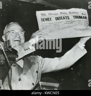 Harry S. Truman, president-elect, holds up edition of Chicago Daily Tribune with headline 'Dewey Defeats Truman'. The Republican newspaper followed the public polls predictions that Truman would be defeated by Dewey. Instead, Truman won with electoral votes to spare and a 49.6 % of the popular vote to Dewey's 45.1 %. Nov. 3, 1948. - (BSLOC 2014 15 54) Stock Photo
