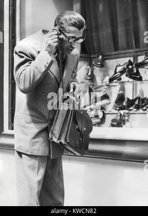 The 'Telephonogramme' in use of the streets of Paris, May 10, 1950. This was an early wireless mobile telephone that could fit into a briefcase. - (BSLOC 2014 17 110) Stock Photo