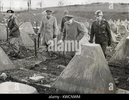 Churchill and Commanders visit the Western Front on March 4, 1945. Winston Churchill walked in the 'dragon's teeth' of the Siegfried Line near Aachen, with him, L-R: Field Marshall Montgomery, Sir Allen Brooke, unidentified U.S. Officer, Churchill, and Lt. General William Simpson of 9th American Army. - (BSLOC 2014 17 39) Stock Photo