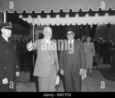 President Harry Truman and Prime Minister Liaquat Ali Khan of Pakistan in Washington, D.C. In background is First Lady Bess Truman. May, 3, 1950. - (BSLOC 2014 15 32) Stock Photo