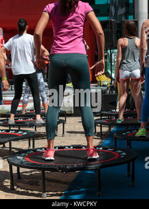 Mini Trampoline Workout: Girl doing Fitness Exercise in Class at Gym Stock  Photo - Alamy