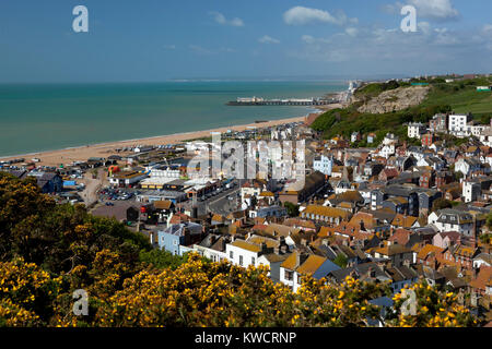 HASTINGS, EAST SUSSEX, ENGLAND: View over the old town and beach with pier in distance from East Hill Stock Photo