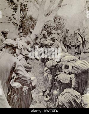 World War 1 in Africa. Indian Sepoys fought for the British in East Africa. Photo shows them crowding around a camp watering trough during the dry season of 1917. (BSLOC 2013 1 45) Stock Photo