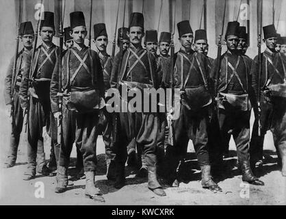 Turkish army c. 1910-1913, in traditional uniforms. They have baggy pants, tunics worn under a short jacket, and the classic fez. Under the influence of their WW1 ally, Germany, these were abandoned for modern western uniforms and helmets (BSLOC 2017 1 130) Stock Photo