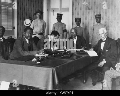 President Philippe Sudre Dartiguenave, seated, 2nd from left, with cabinet ministers, Nov. 1915. In the left background, stands his bodyguard, US Marine Sergeant H.E. Miller. Dartiguenave was from Haitis mulatto elite, and not supported by the nations poor black majority (BSLOC 2017 2 77) Stock Photo