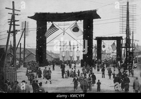 Decorated gates in Yokohama, with flags of the US and Japan, Oct. 1908. Japanese postcard commemorates the Great White Fleets visit. It posts a welcome sign in spite of tense relations between the US and Japan over Asian territory and bad treatment of Japanese in America (BSLOC 2017 2 86)