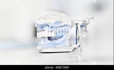 Dental articulator isolated on white background, dentist technical tools Stock Photo