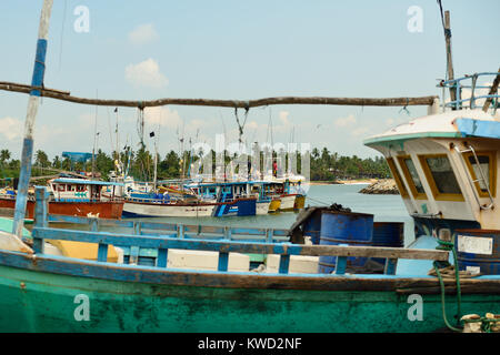 TANGALLE, SRI LANKA - 26 FEBRUARY 2015: Fishing cutters in the fishing harbour in Tangalle Stock Photo