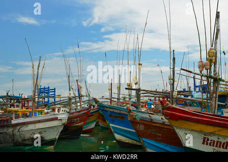 TANGALLE, SRI LANKA - 26 FEBRUARY 2015: Fishing cutters in the fishing harbour in Tangalle Stock Photo