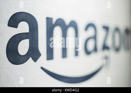 KIEV, UKRAINE - January 02, 2018: Black and white Amazon logotype printed on paper. An American electronic commerce company Stock Photo