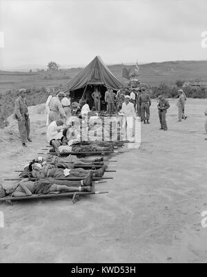 Litter cases of North Korean War POWs are exchanged during Operation Little Switch. They are at the Communist receiving center at Panmunjom, Korea. April-May, 1953. Korean War, 1950-53. (BSLOC 2014 11 174) Stock Photo