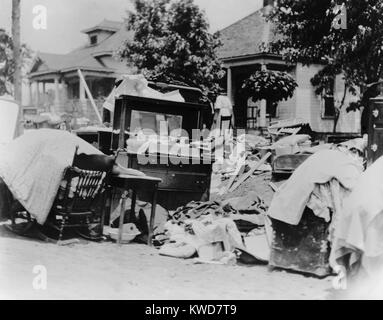 Furniture and belongings in Tulsa street during race riot of May 31 - June 1, 1921. Original caption states the owner was probably evicted during the riot. Photo by Alvin C. Krupnick Company, Tulsa, Okla. (BSLOC 2015 16 157) Stock Photo