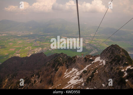 View of the Salzburg basin and the cable car rope from the Untersberg mountain top. Stock Photo