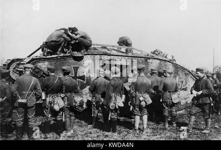 World War 1 Tanks. German soldiers standing on and around a tank with an Iron Cross insignia. It is one of approximately 50 British tanks captured, repaired, and used in battle by the Germans. Ca. 1917-18. (BSLOC 2013 1 157) Stock Photo