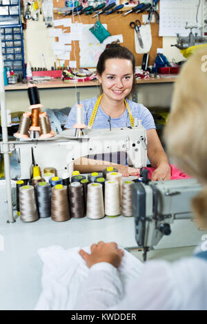 Portrait of two professional female tailors working in the sewing workshop Stock Photo