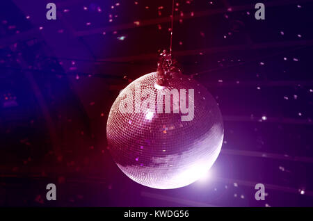 Disco ball on the top of the soffit. Party night background Stock Photo