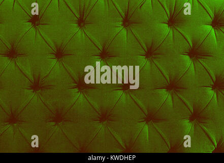 Close up view on bright pink textile texture of sofa Stock Photo