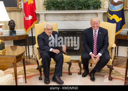 President Donald Trump meets with former Secretary of State Henry Kissinger, May 10, 2017. When Trump and Kissinger met with reporters, the previous days firing of FBI Director James Comey dominated the public dialogue (BSLOC 2017 18 165) Stock Photo