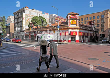 People pedestrians walking along S Broadway Avenue near El Pollo Loco Mexican restaurant in downtown Los Angeles California, USA  KATHY DEWITT Stock Photo