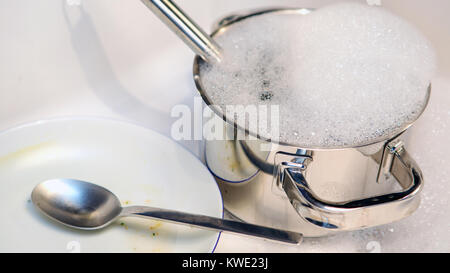 close up of dirty dishes in a kitchen sink Stock Photo