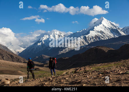 Trekkers walking upto Chandrataal lake from the campsite in Spiti Valley, Himachal Pradesh. Stock Photo
