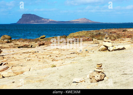 Layered beach formation at Baia da Murdeira, Sal Island, Salina, Cape Verde with Monte Leao, Lion Mountain on the horizon, Africa Stock Photo