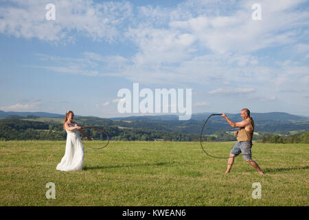 rider woman with whip is sitting on hay Stock Photo - Alamy