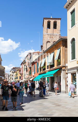 Busy street scene in Strada Nova, Cannaregio, Venice,  Veneto, Italy with Chiesa di Santa Sofia and pedestrians Stock Photo