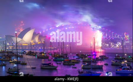 Australia celebrates the arrival of 2018 with New Years Eve fireworks on Sydney Harbour. The popular annual event attracts a crowd of over one million. Stock Photo