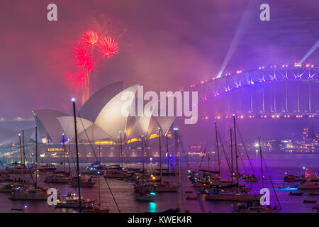 Australia celebrates the arrival of 2018 with New Years Eve fireworks on Sydney Harbour. The popular annual event attracts a crowd of over one million. Stock Photo
