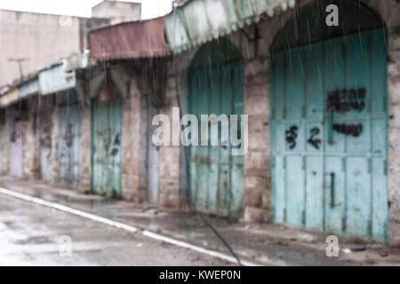 Hebron, Palestine, January 8 2011: Abandoned Palestinian shops on Shuhada street. It used to be main street of Hebron, it is now closed for Palestinia Stock Photo