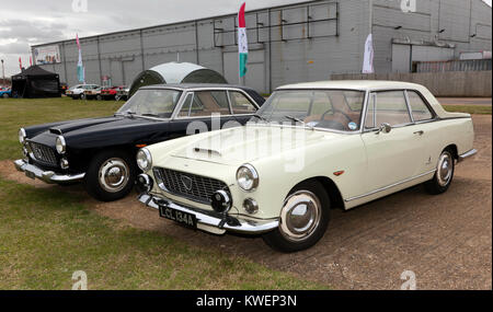 Three-quarter front view of two Lancia Flaminia Coupé's on display at the 2017 Silverstone Classic Stock Photo