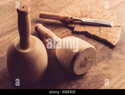 Still life of carving tools on wooden table Stock Photo