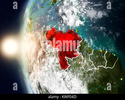 Satellite view of Venezuela highlighted in red on planet Earth with clouds and visible country borders during sunset. 3D illustration. Elements of thi Stock Photo