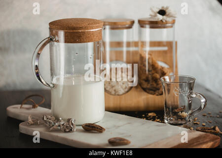 Flakes and cup of milk for breakfast. Concept of healthy food. Warm toning image. Rustic styling. Stock Photo
