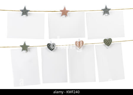 Blank cards pinned on the rope on white background, copy space Stock Photo