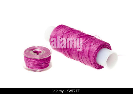 spool of pink thread isolated on white Stock Photo