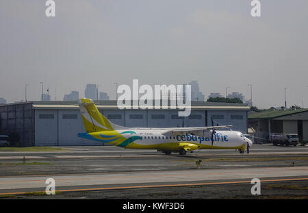 Manila, Philippines - Apr 12, 2017. A civil aircraft on runway at Ninoy Aquino Airport (NAIA) in Manila, Philippines. In 2015, NAIA handled a record b Stock Photo