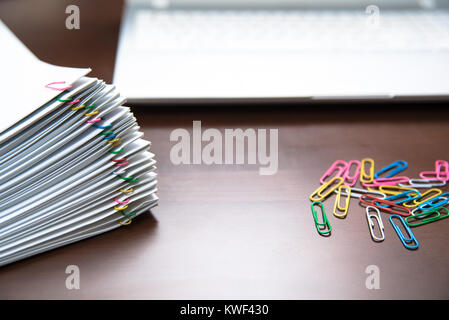 Pile of paper with colorful clips Stock Photo