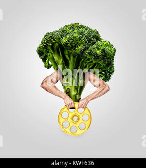 Broccoli with muscular man's hands. Stock Photo