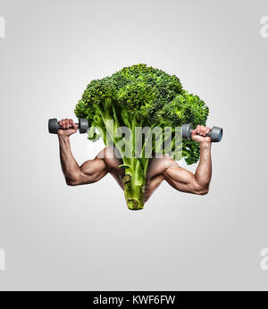 Broccoli with muscular man's hands. Stock Photo