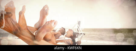 Happy couple napping together in the hammock Stock Photo