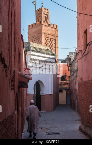 Back street in the medina with traditional architecture, windows, doors and arches and Mosque. Stock Photo