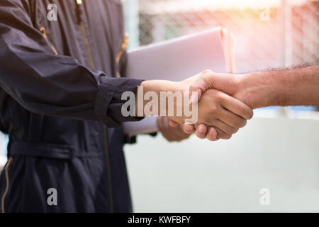 engineer shaking hand with with colleagues  to cooperate and deal in business successful Stock Photo