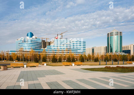 The futuristic ultra-modern colourful glass and steel Eurasian Bank headquarters building in autumn, Nur-Sultan (Astana), capital city of Kazakhstan Stock Photo