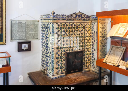 Old-fashioned ceramic stove heater in the First Romanian School Museum, Schei district, Brasov, a city in the central Transylvania region of Romania Stock Photo