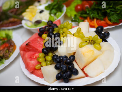 grapes,watermelon and other fruits on cafe table Stock Photo