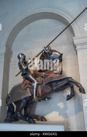 The representation of a medieval know mounted and dressed for battle in a full suite of armor. military museum, Les Invalides, Paris, France Stock Photo