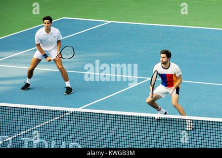 Pune, India. 2nd Jan, 2018. Pierre-Hugues Herbert and Gilles Simon of France in action in the first round of Doubles competition at Tata Open Maharashtra at the Mahalunge Balewadi Tennis Stadium in Pune, India. Credit: Karunesh Johri/Alamy Live News Stock Photo