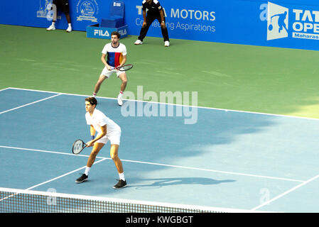 Pune, India. 2nd Jan, 2018. Pierre-Hugues Herbert and Gilles Simon of France in action in the first round of Doubles competition at Tata Open Maharashtra at the Mahalunge Balewadi Tennis Stadium in Pune, India. Credit: Karunesh Johri/Alamy Live News Stock Photo